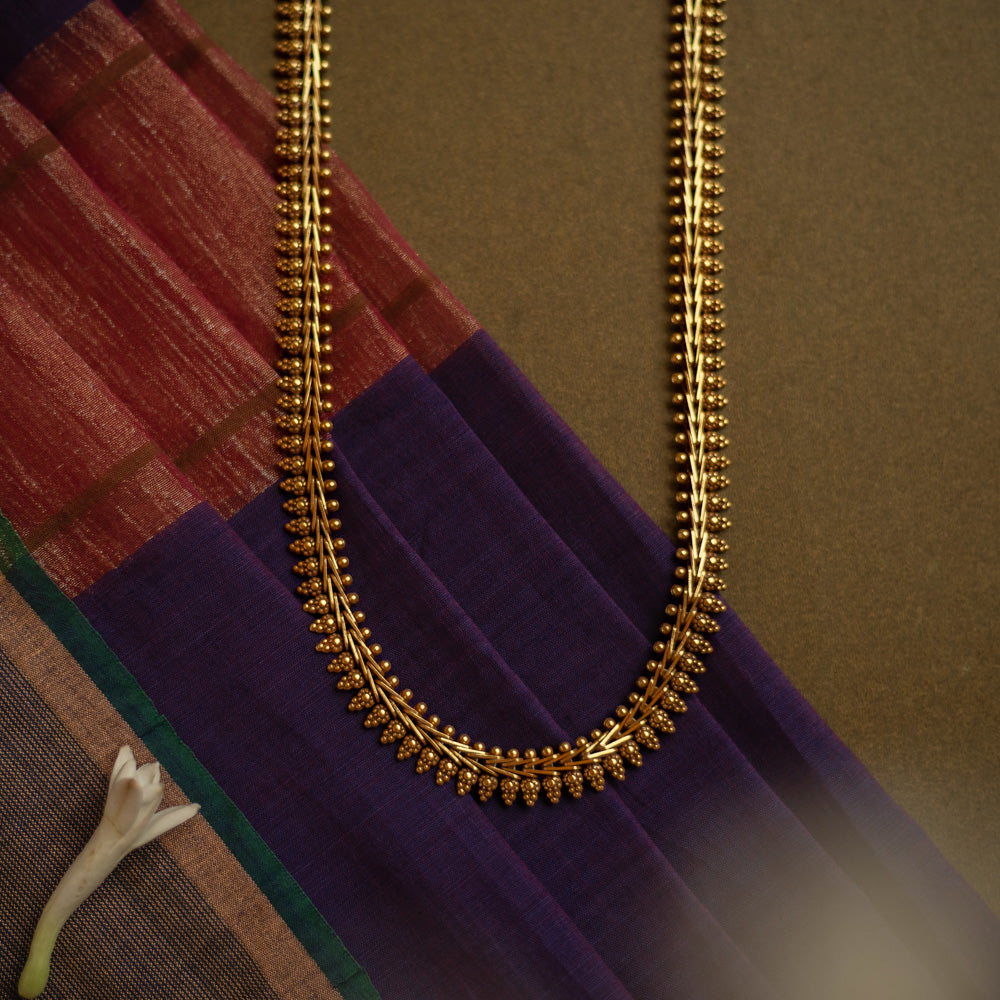 Gold-tone traditional necklace with vine and bud motifs from the Katha Collection.