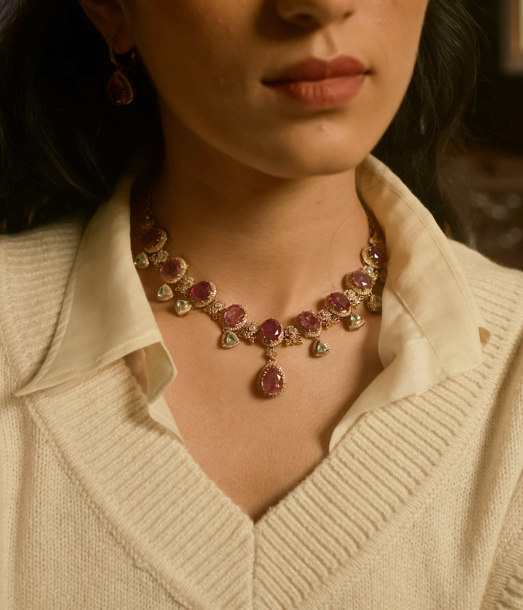 Victorian necklace with red Polki stones, green Polki drops, and CZ floral detailing in gold finish.