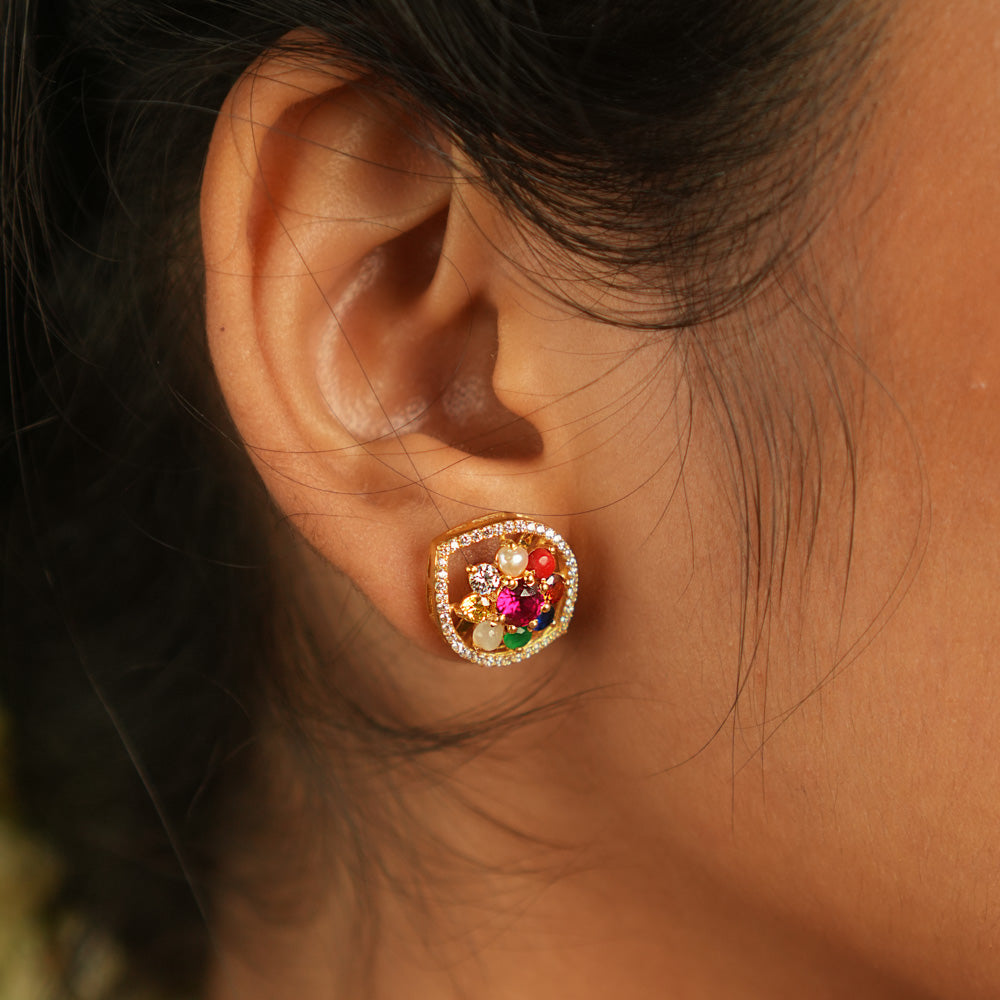 Celestial whispers reborn! Navratna and moissanite stud earrings: A symphony of stars embracing ancient wisdom, radiating timeless allure.