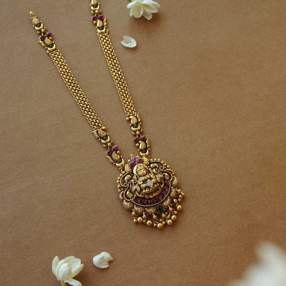 Golden temple necklace with intricate goddess-inspired design for divine elegance and cultural charm.
Main Description: