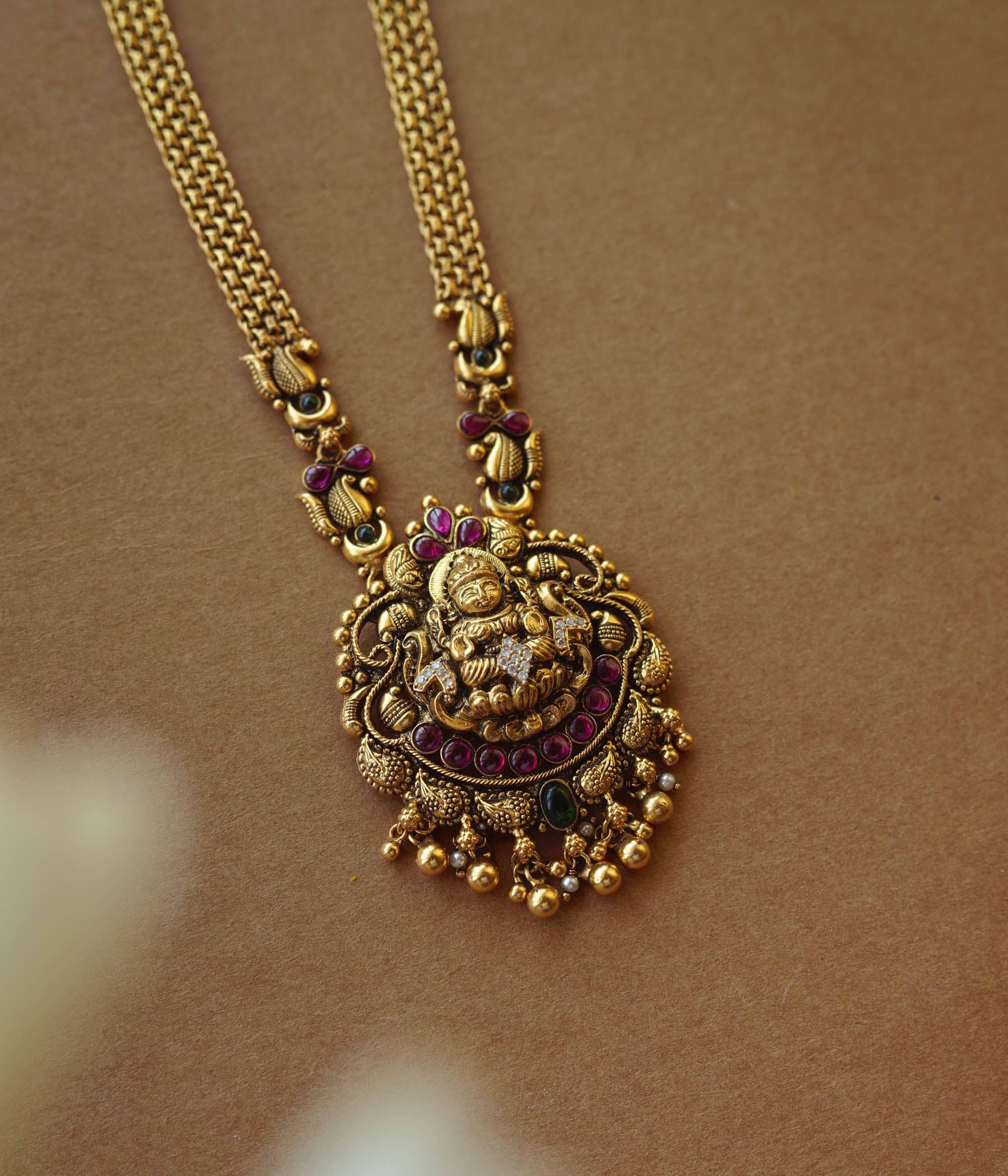 Golden temple necklace with intricate goddess-inspired design for divine elegance and cultural charm.
Main Description: