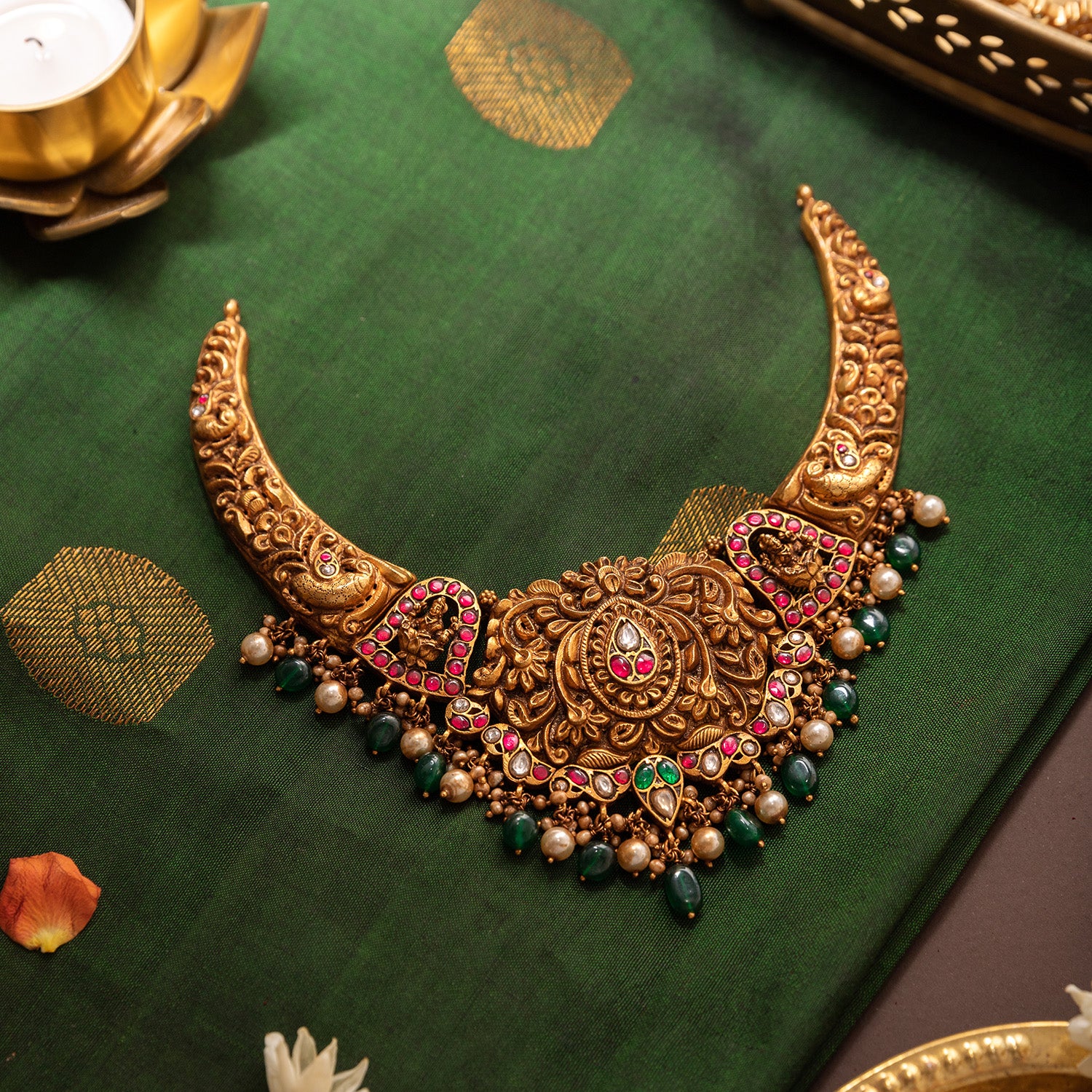 Arinaya silver necklace with red and green Kundan stones

